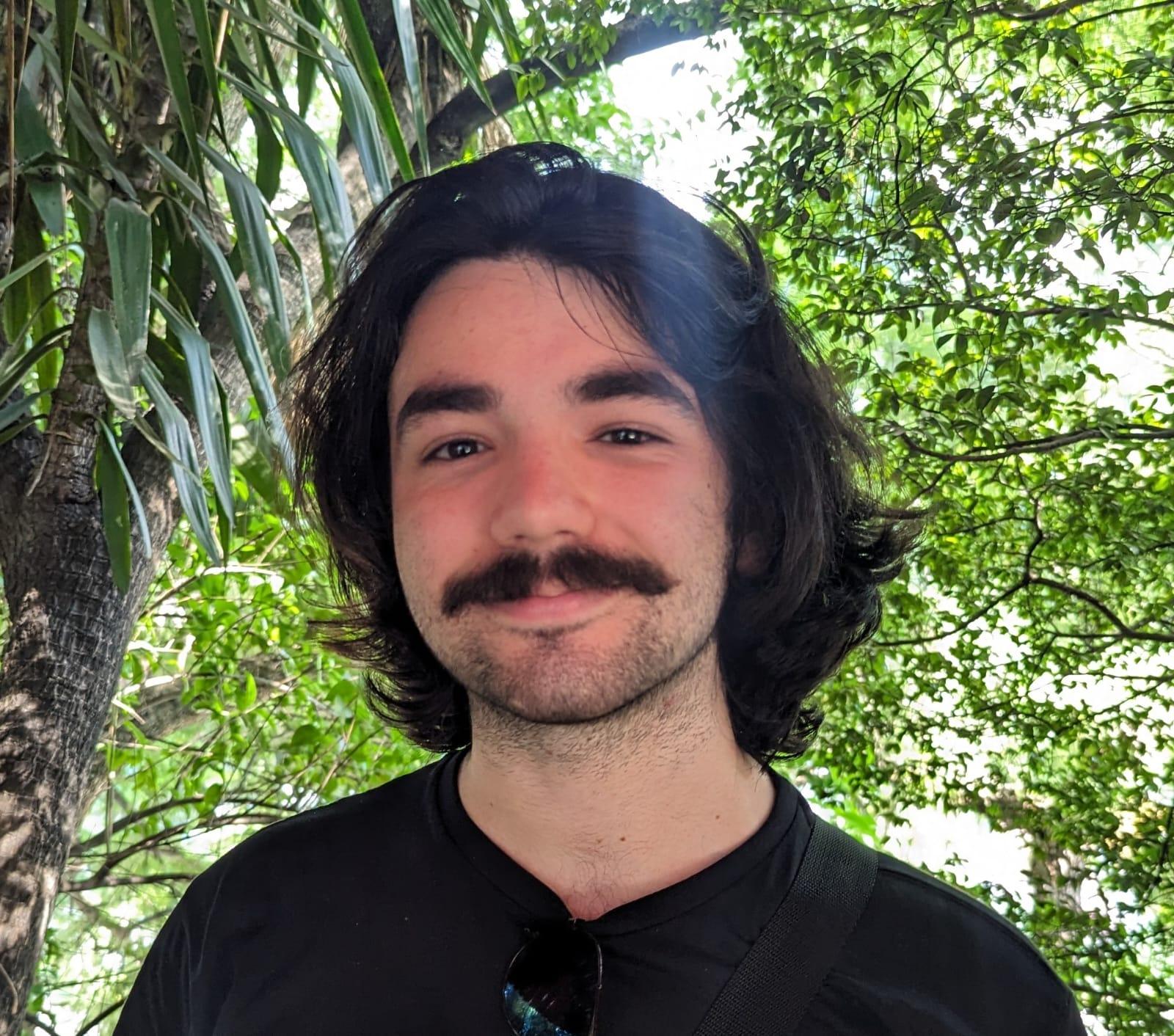 Image of Davi Gressler in front of trees