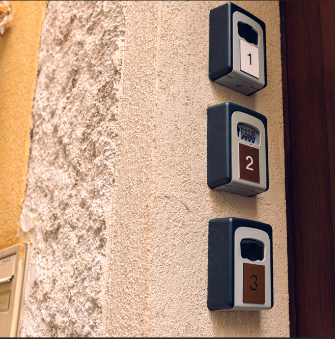 Key lock boxes outside an airbnb property